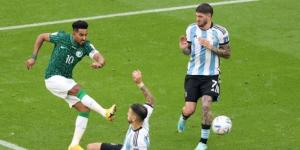 Argentina and Saudi Arabia players vie for the ball at the 2022 FIFA World Cup on November 22 in Qatar.