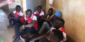 A group of Arsenal fans at the Jinja Police Station in Uganda after they were arrested for conducting an EPL trophy parade in the City on January 23, 2023. 