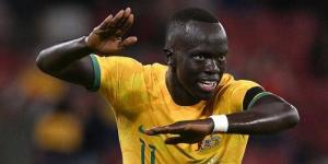 Kenyan-born winger Awer Mabil celebrates scoring a goal for Australia. 