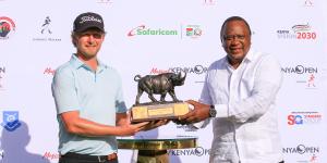 South African, Justin Harding, is presented with the Keya Open Golf Championship trophy by President Uhuru Kenyatta after at the Karen Country Club. 