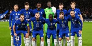 Chelsea's football team posing for a photo on the football pitch