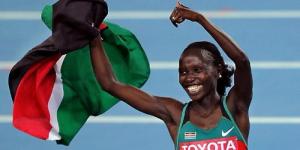 Vivian Cheruiyot celebrates winning a medal for Kenya in a past international event.