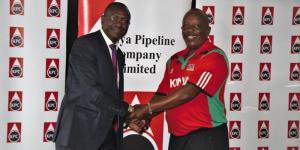 An undated photo of the Kenya Pipeline head coach Paul Gitau Mburu (left) shaking hands with an official from the government parastatal. 