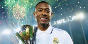 An undated photo of Real Madrid left-back David Alaba posing for a photo with a trophy. 