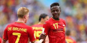 From left to right: AC Milan striker Divock Origi shakes hands with Manchester City midfielder Kevin De Bruyne during the 2014 FIFA World Cup in Brazil.