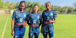 Harambee Starlets defender Dorcas Shikobe (L), her new teammate (M), and Faith Omondi (R) pose for a photo after joining Indian side Sethu FC on December 24, 2022.