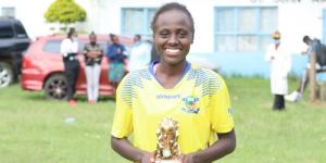 Harambee Starlets wingback Enez Mango poses for a photo with her 2021 KWPL most valuable player award on October 2.