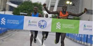 Kenyan runner Ezekiel Kemboi Omullo celebrates winning the Standard Chartered Singapore Marathon on December 4, 2022.