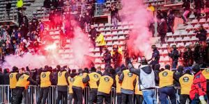 Lyon and Paris FC fans trying to invade the pitch during a match that led to suspension of the game.
