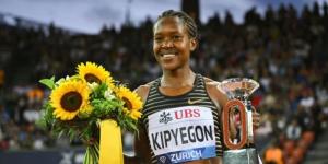 Faith Kipyegon poses for a photo with the Diamond League trophy on September 9, in Zurich, Switzerland. 