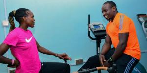 From left to right: 1,500m Olympic champion Faith Kipyegon shares a light moment with African 100m record holder Ferdinand Omanyala.