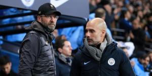 From left to right: Liverpool manager Jurgen Klopp standing alongside his Manchester City counterpart Pep Guardiola in a past match.