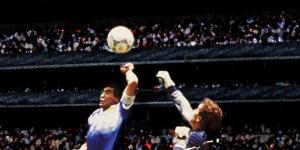 The late Diego Maradona (L) scores the famous "Hand of God" goal on June 2022, 1986 in Mexico.