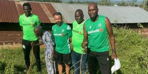 Gor Mahia Technical Bench, defender Joachim Oluoch and Gor Makogalo's descendant at the shrine 