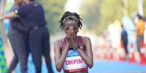 Kenya's Irene Cheptai celebrates winning the 2022 Vedanta Delhi Half Marathon title on October 16 in India.