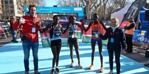 Kenyan athletes Irene Kimais (second from left), Joyciline Jepkosgei (centre) and Catherine Reline (second from right) pose for a photo with race stakeholders on Sunday, February 19, 2023, after registering a clean podium sweep at the Barcelona Half Marathon. 