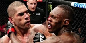 From left to right: Brazilian mixed martial artist Alex Pereira punches Nigerian kickboxer Israel Adesanya on November 13, 2022 in New York, United States.