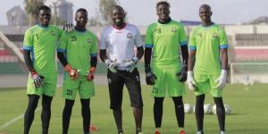 Former Gor Mahia star Jerry Onyango (centre) poses for a photo with Harambee Stars goalkeepers in a past training session. 