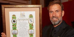 Jurgen Klopp poses for a photo with the Freedom of the City of Liverpool award on November 2, 2022 in England.