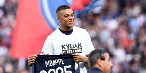 Kylian Mbappe posing for a photo after extending his contract with PSG on May 21, 2022 in Paris, France.