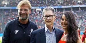 From left to right: Liverpool manager Jurgen Klopp poses for a photo alongside the clubs principal owner John Henry and his wife Linda Pizzuti.