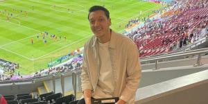 Former Arsenal star Mesut Ozil poses for a photo in a stadium in Qatar on December 1, 2022.
