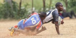  Ofafa Jericho’s Steve Otieno (L) tackles Mike Kuria (R) of Upper Hill during Nairobi region qualifiers held at Lenana School on August 28, 2022.