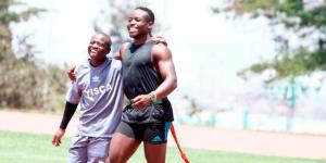 Ferdinand Omanyala hanging out with a kid on August 20, 2022 in Nairobi, Kenya.