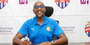 Nairobi City Stars CEO Patrick Korir signs a document at the club's office. 