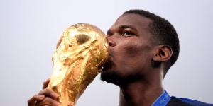 Paul Pogba kissing the FIFA World Cup trophy on July 15, 2018 in Moscow, Russia.