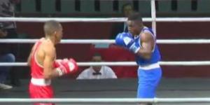 From left to right: Kenya's Samuel Njau in action against Sigauque Moz of Mozambique on September 17, 2022 in Maputo.