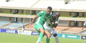 Gor Mahia forward Wilson Silva tussles for the ball with KCB's Denis Odhiambo