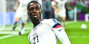 Timothy Weah celebrates scoring a goal for the United States at the 2022 FIFA World Cup on November 21in Qatar. 