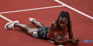 Kenya's runner Mary Moraa relaxing on the track during the postponed Tokyo 2020 Olympic Games in Japan. 