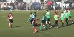 An image showing a female referee being attacked in a match involving two Argentine football clubs on August 1, 2022. 
