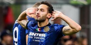 Inter midfielder Hakan Calhanoglu celebrating his goal against AC Milan at the San Siro on November 8