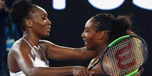 Venus Williams (L) embracing her younger sister Serana Williams (R) at the Australian Open Tennis Tournament on January 28, 2017.