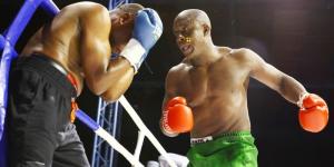 From left to right: Kenya's Daniel Wanyonyi shields himself from Karim Mandonga's punches on January 14, 2022, at the KICC, Nairobi.