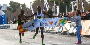 Kenya's Weldon Langat celebrates winning the 2023 10K Valencia road race on January 15 in Spain. 