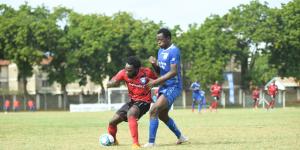 AFC Leopards striker Elvis Rupia tussles for the ball with a Bandari opponent in an FKF PL fixture at Mbaraki Stadium.