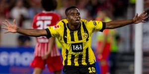 Youssoufa Moukoko celebrates scoring a goal for Borussia Dortmund on August 15, 2022.