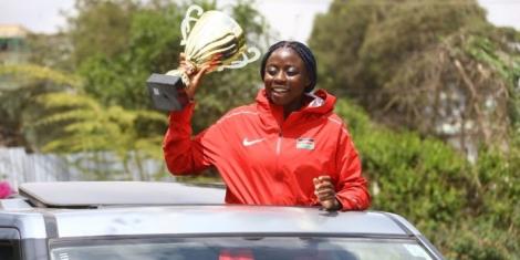 18-year-old Angela Okutoyi showcasing her Australia opens trophy.