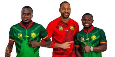 Cameroonian players pose for a photo wearing the 2022 FIFA World Cup kit manufactured by One All Sports.