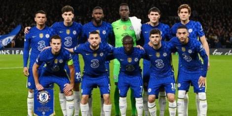 Chelsea's football team posing for a photo on the football pitch