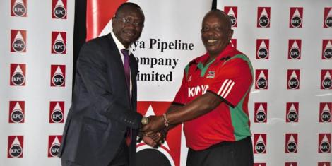 An undated photo of the Kenya Pipeline head coach Paul Gitau Mburu (left) shaking hands with an official from the government parastatal. 