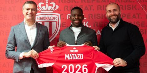 Eliot Matazo (M) poses for a photo with AS Monaco officials after extending his contract to 2026 on January 13, 2022 in France.