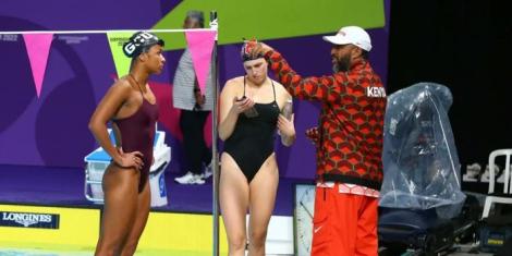 Kenyan swimmer Emily Muteti (L) receiving introductions from his coach (R) in a past competition.