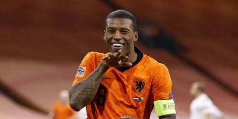 Georginio Wijnaldum celebrating scoring a goal for Netherlands in a past match.