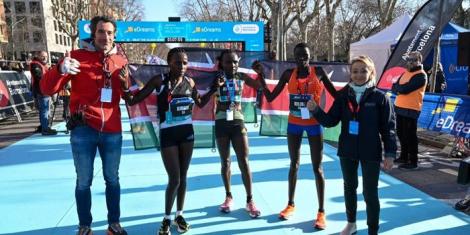 Kenyan athletes Irene Kimais (second from left), Joyciline Jepkosgei (centre) and Catherine Reline (second from right) pose for a photo with race stakeholders on Sunday, February 19, 2023, after registering a clean podium sweep at the Barcelona Half Marathon.