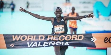 Kenya's Kibiwott Kandie celebrates breaking the world record at the 2022 Valencia Half Marathon edition.